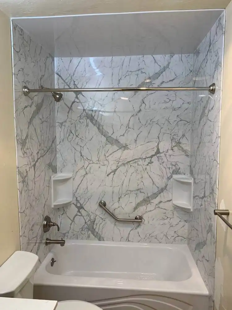luxury shower tub with white marble wall surrounds and silver accents