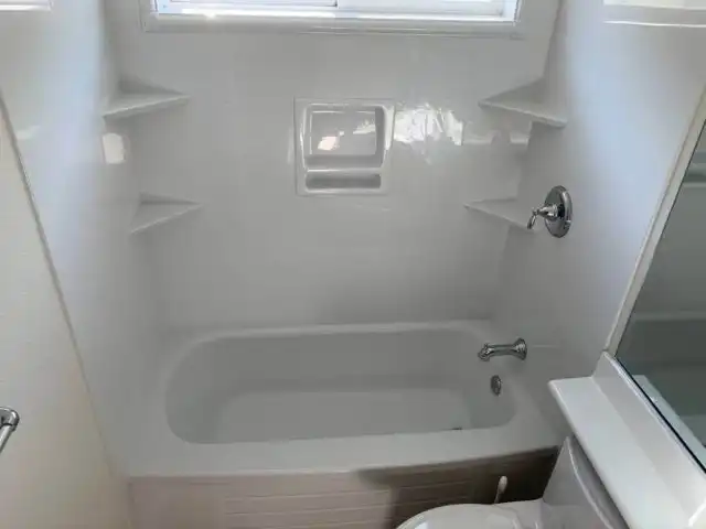 acrylic white  bath shower combo remodel