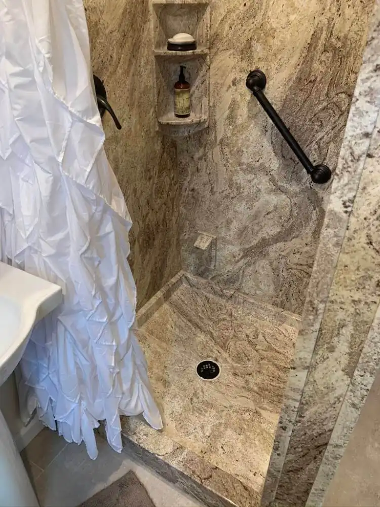 modern shower upgrade with marble wall surrounds