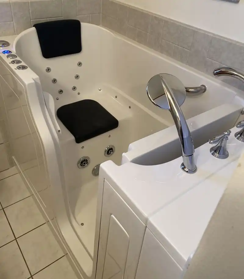 jetted walk in tub with a chair seat