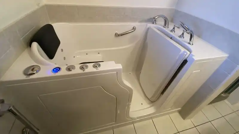 jetted walk in tub with a chair seat